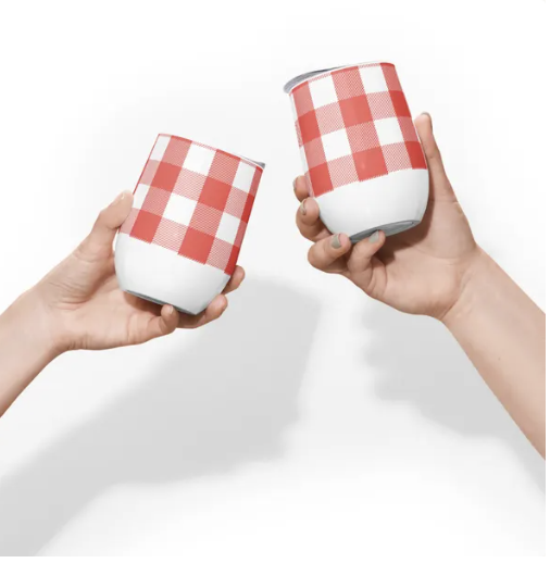 "Two hands holding Red Gingham patterned wine tumblers, symbolizing warmth, joy, and sharing cozy moments."