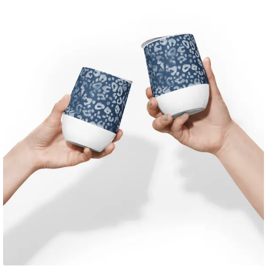 "Two hands holding Denim-Like patterned wine tumblers, perfect for casual and stylish moments with a cozy touch."